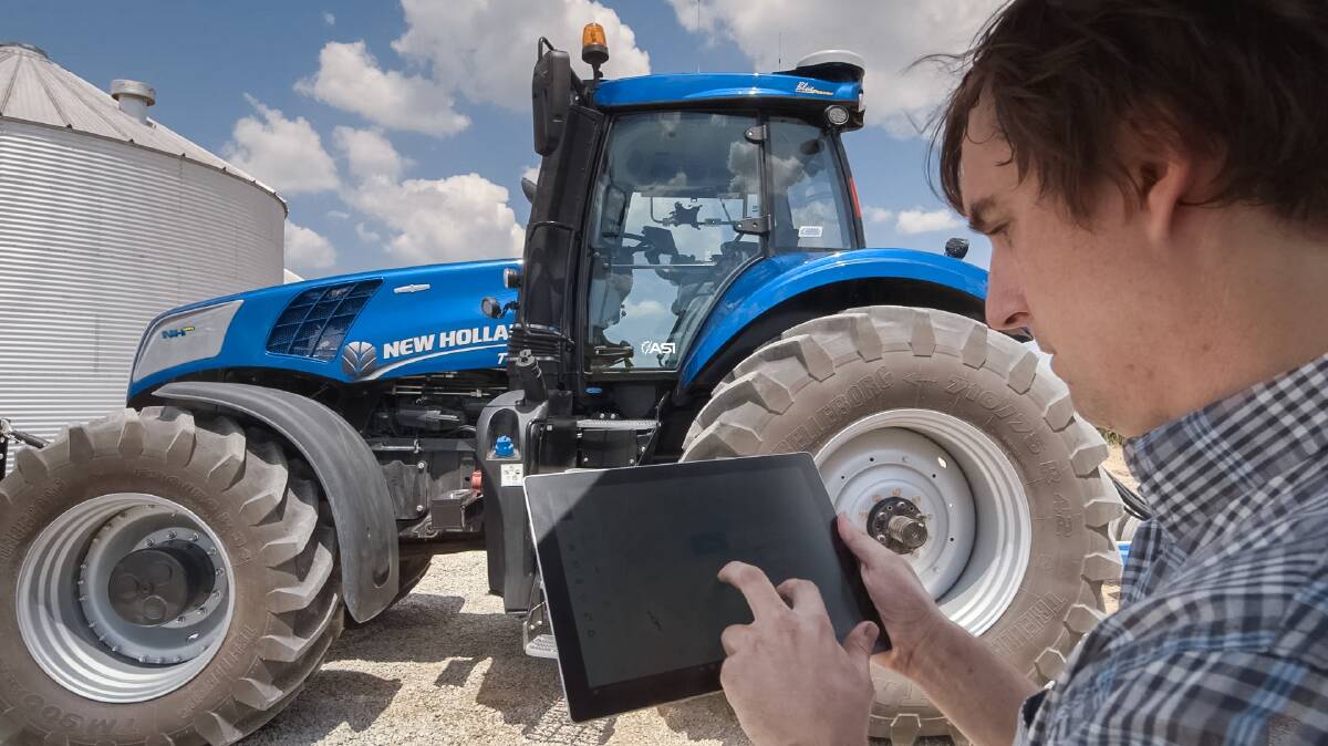 The New Holland NH Drive autonomous concept tractor is controlled through a portable tablet.