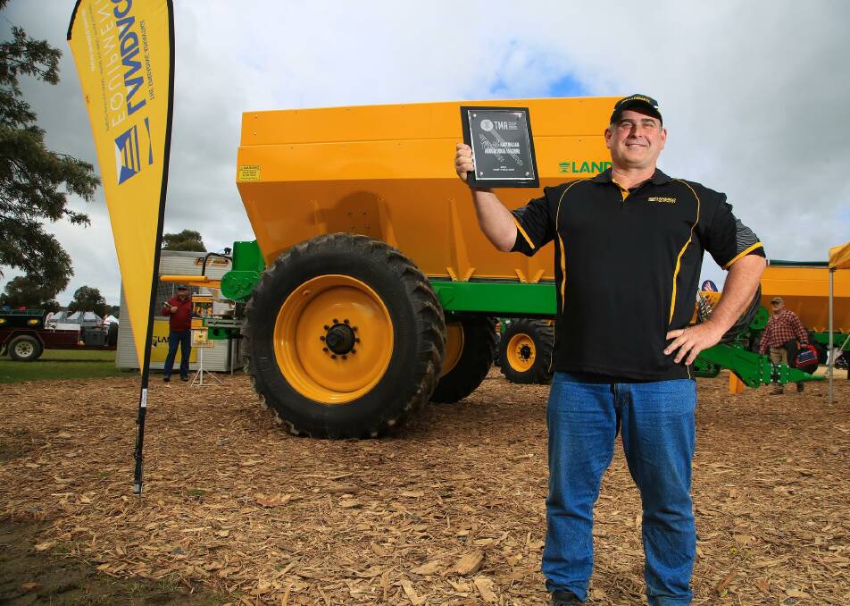 Landaco Equipment principal Peter Connor, of Wagga, celebrates winning the Tractor and Machinery Association Award with his Maxispread bulk spreader