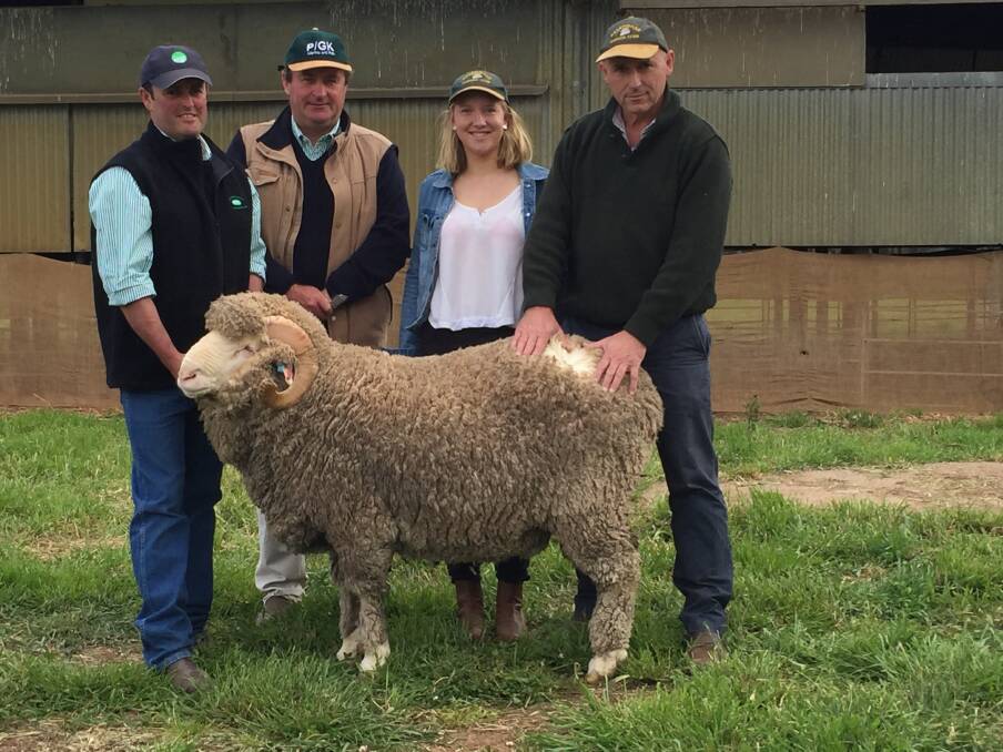 Sean Carroll, overseer and John Sutherland, manager, Pooginook Merinos, Jerilderie, with Imogen and Tony Inder, "Nyrang", Wellington, purchasers of the top priced Merino ram at $15000.
