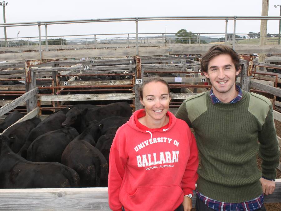 Paige and John Cameron with the family's Summerglen calves. This pen of 10 Boonaroo blood steers, 386kg, sold for 370c/kg to Landmark Leongatha.