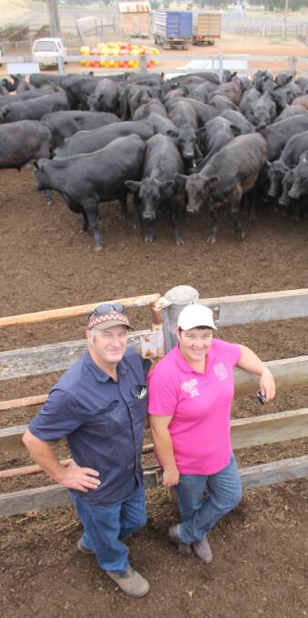 Kelvin and Julie Bateman, Baroona, with their top pen of 64 Pathfinder blood calves, which had an average weight of 392kg - 32kg above last year's top pen.