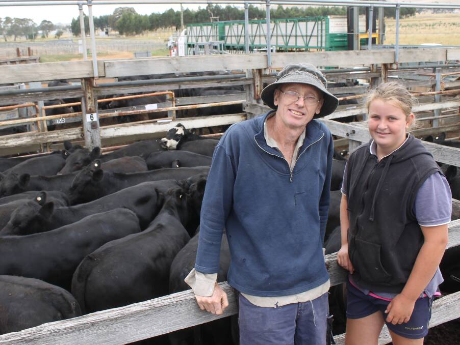 Michael Moran, Lawford Park, and niece Gretta Gleeson, 12, with his top pen of 22 Dollar Angus blood calves, 366kg, that made 376c/kg.
