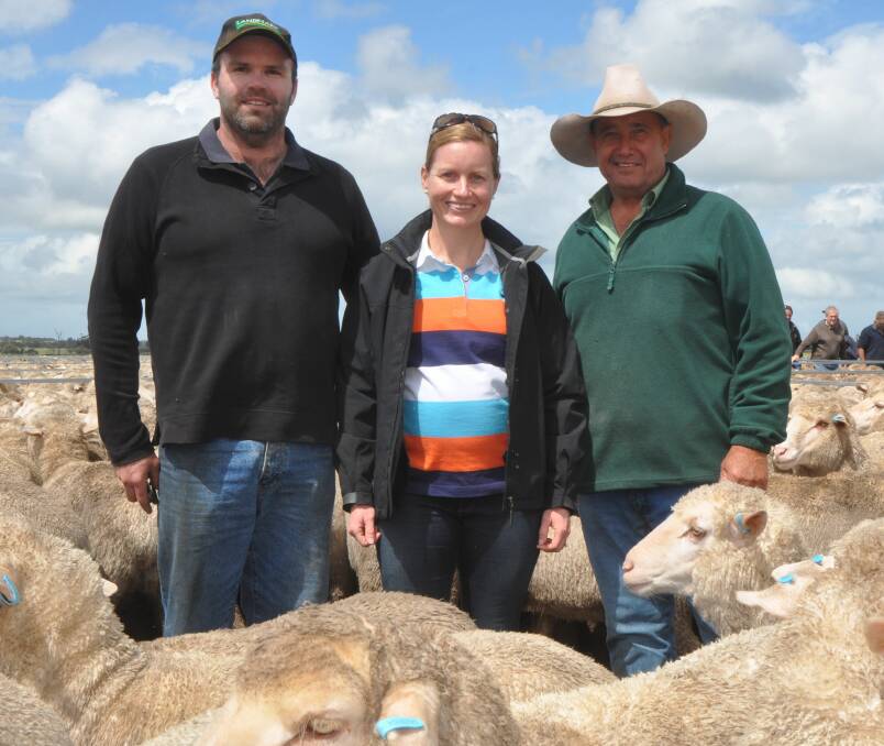 WELL-BRED DRAFT: Landmark Keith's Noel Evans (right) with Jon and Louise Densley, Keith, who sold 820 1.5-year-old ewes to $262, av $250.