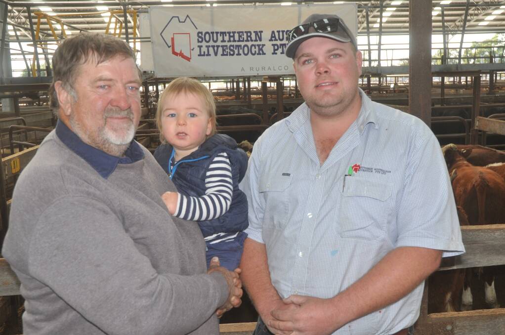 WHITEFACE WINNERS: John Randell, Andran Pty Ltd, Stewarts Range (pictured with 18-month-old grandson Edward Fitzgerald) and agent Mat Macdonald received $4.04/kg for 18 EU, May-June 2016 drop steers, equating to $1430. Andran also sold 19 heifers for  $1287.