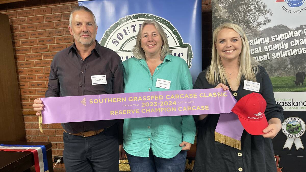 Peter and Karen Black, Casterton, Vic, exhibited the reserve champion carcase. Presenting the ribbon is SGCC secretary Emma Phillips.