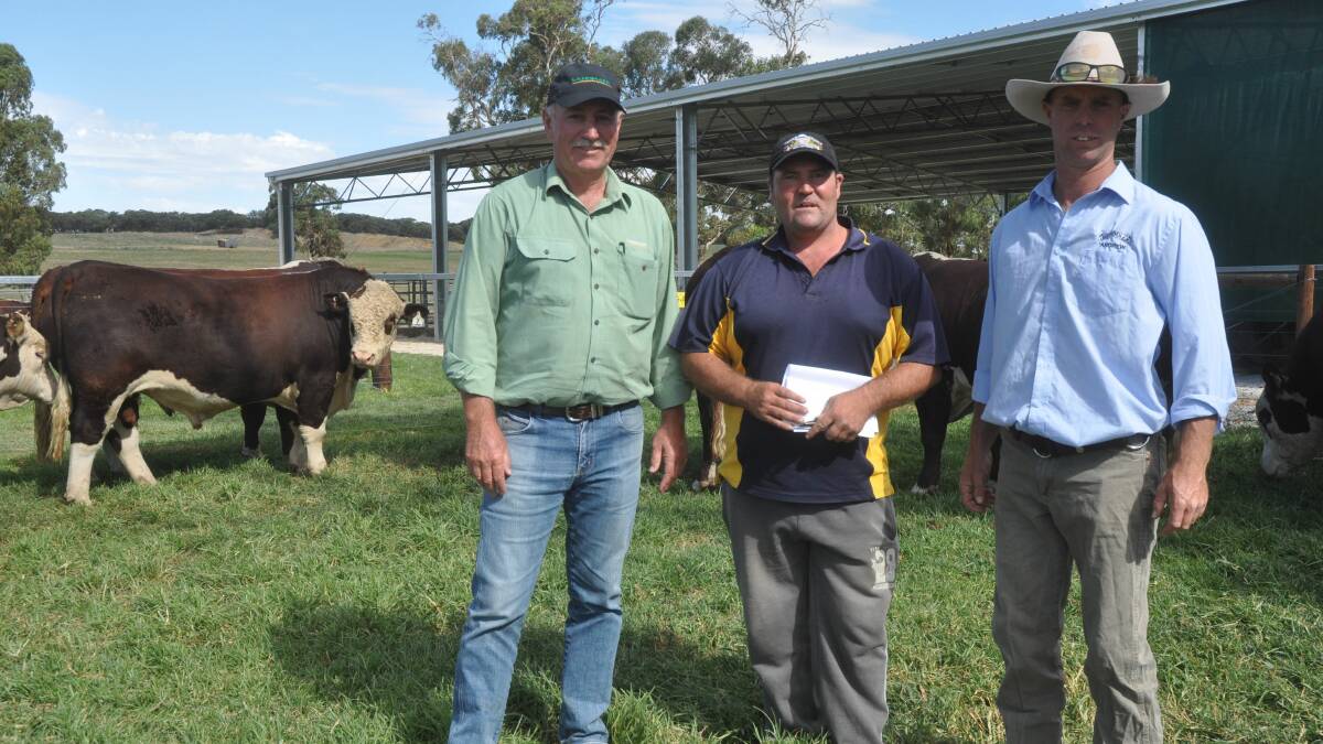 BENDULLA'S BEST: Landmark Kingston branch manager Trevor Wiseman with client Bruce Parker, Kingston who bought the $11,500 top priced Bendulla bull. They are pictured with Bendulla stud principal Andrew Bennett. 