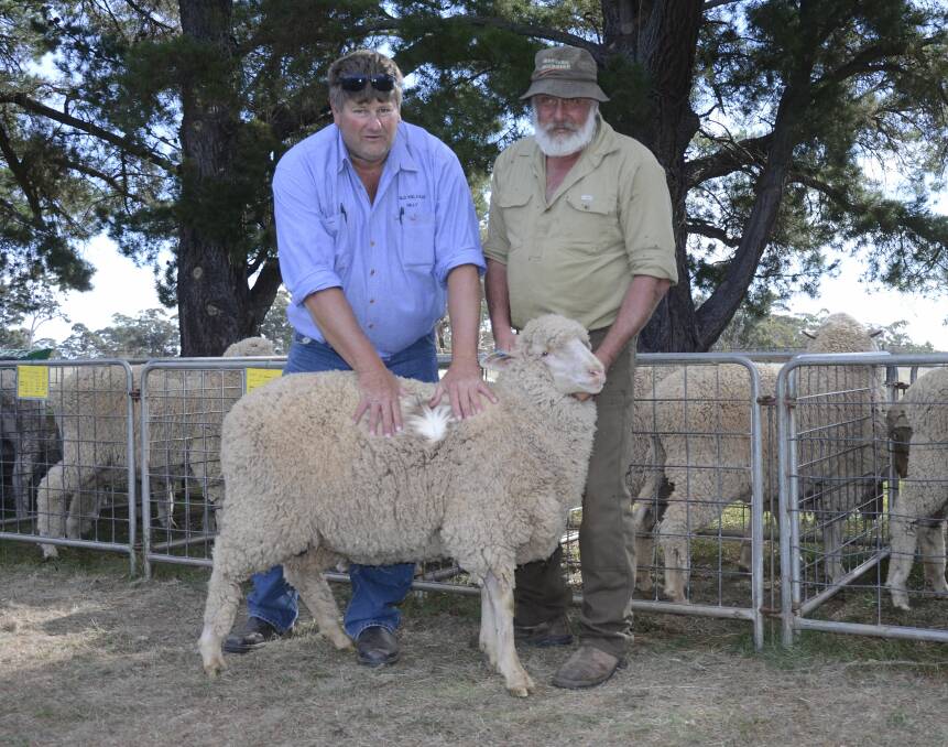 WOOLLY WINNER: Judge David Hill, Old Kelvale, Burra, and the 2016 winner of the overall hogget of the day Ron Bellchambers, Eudunda.