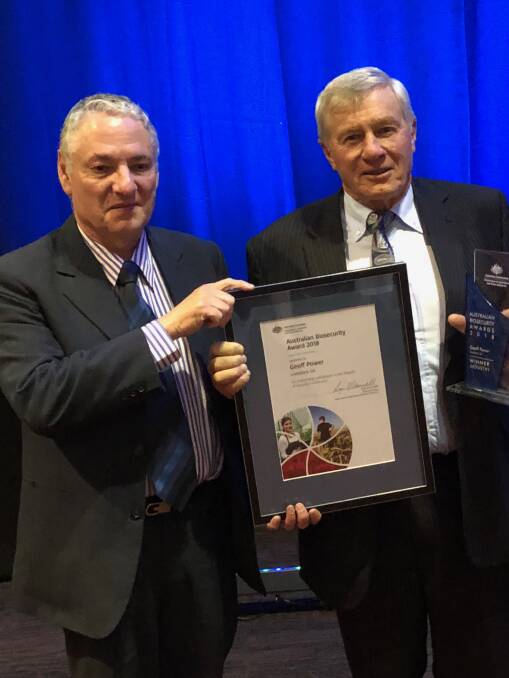 AWARD HONOUR: PIRSA chief veterinary officer Roger Paskin with Geoff Power, Orroroo, who was recognised at the 2018 Australian Biosecurity Awards.