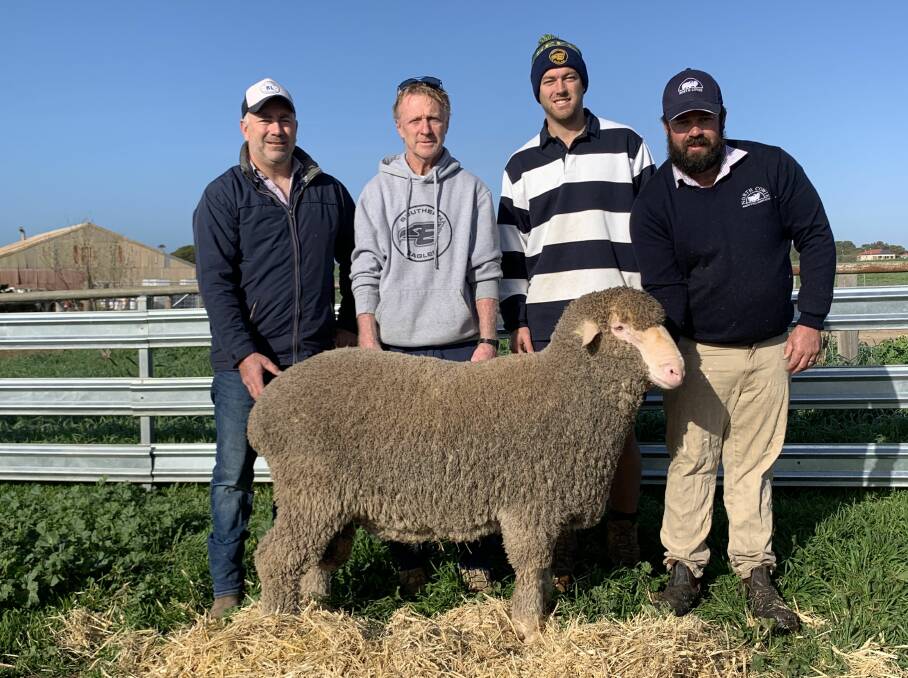 RECORD BREAKER: Ant Bray, Bray Livestock Minlaton with clients Micky and Nathan Allen, Yorketown bought the $7400 sale topper being held by North Cowie stud principal Joe Murdoch, Warooka.