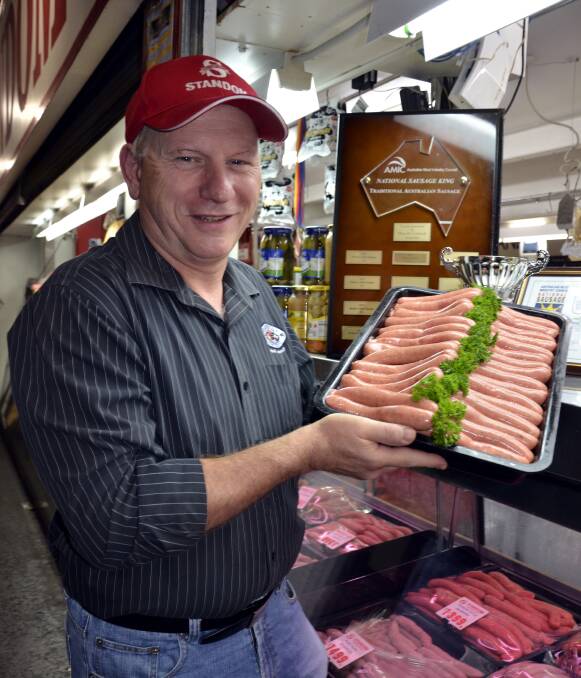 CHAMPION: Barossa Fine Foods managing director Franz Knoll at the Adelaide Central Market with his Standom country style sausages, which won the Traditional Australian category in the Sausage King awards.