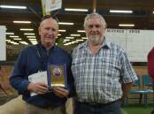 Yorke Peninsula breeder Peter Button receives a life membership plaque from Australian Stud Sheep Breeders Association president Neil Kroehn.
