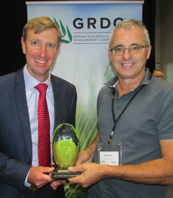 AWARD WINNER: GRDC Southern Regional Panel chair Keith Pengilley presenting Wharminda grower Ed Hunt with the 2017 GRDC Southern Region Seed of Light Award.