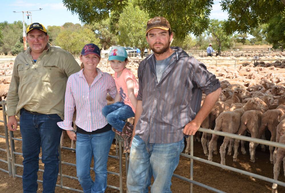 BIG RUN: Braemar Station managers Josh Sheridan and Lisa Breeding with daughter Abby, 5, and station hand Paul Mercer. Braemar sold 2500 wethers at Jamestown. 