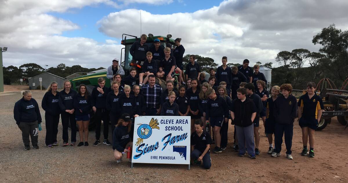 The 2017 Seed to Store Video Clip Competition Grains Ambassador Andrew 'Cosi' Costello (centre) with Cleve Area School students at the school's Sims Farm agricultural property.