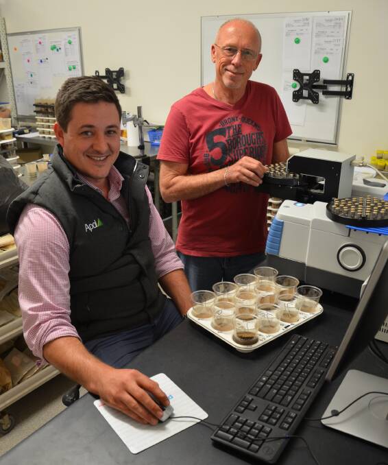 HIGH-TECH: Australian Precision Ag Laboratory's managing director Ryan Walker and infrared specialist Les Janik put soil samples through the mid-infrared spectometer. 