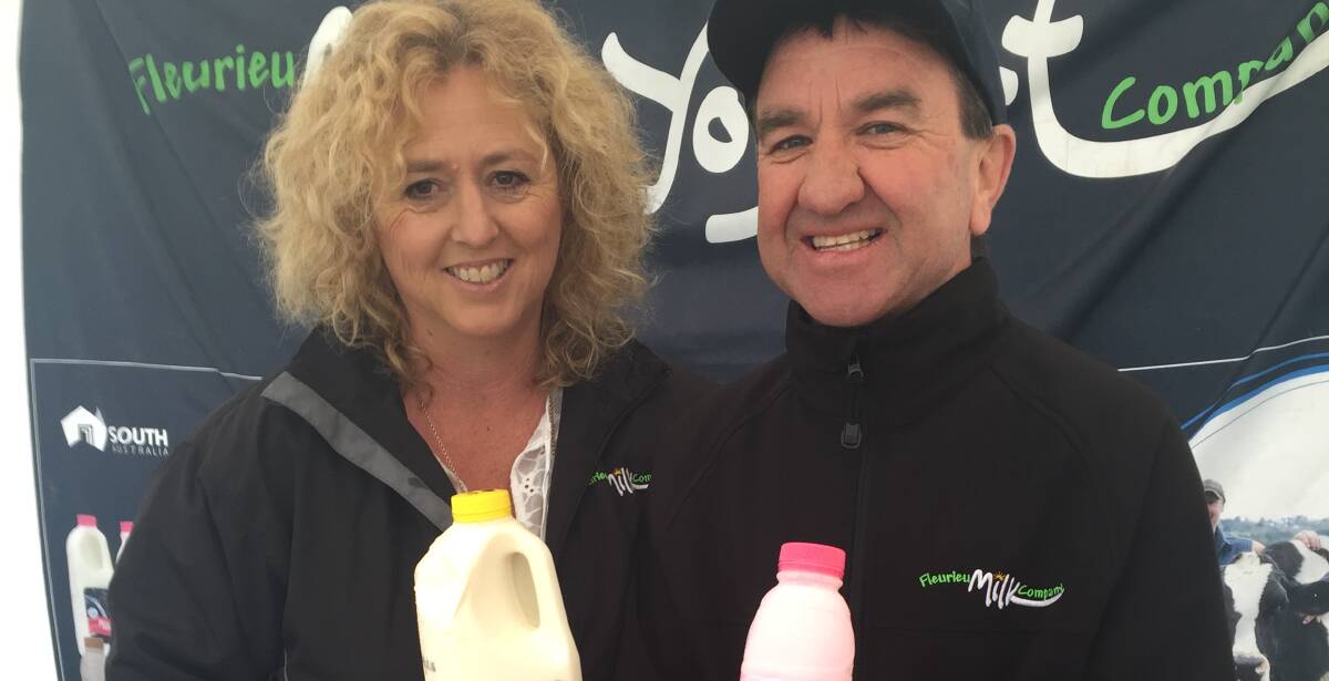 GOT MILK: Andrea and John Maidment, Myponga, handing out milks on the Fleurieu Milk Company stall. FMC proudly sponsored the Meadows Country Fair.