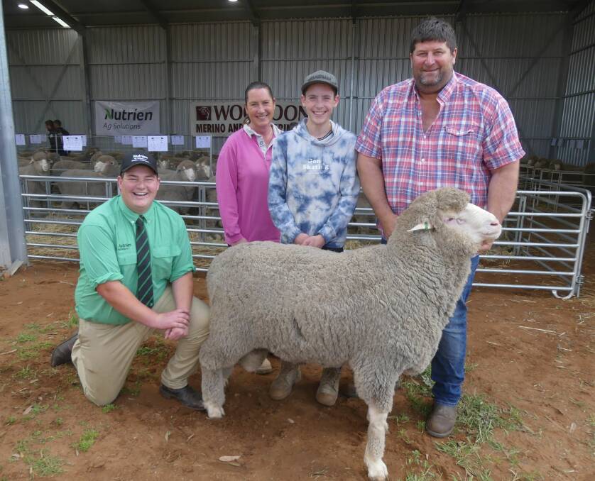RETURN CLIENT: Nutrien's James McInally with $5000 top price ram buyers Anne and Ryan Simcock and Woodoona stud principal Nick Wood. 