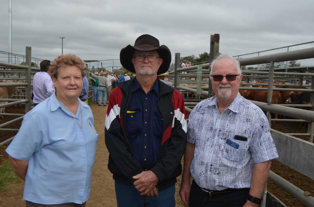 Purchaser of the pen of donated steers Peter Taylor, Zonia Downs, Julia Creek with Legacy Charters Towers' Eileen Vogele and Legacy Townsville's Doug Millican.