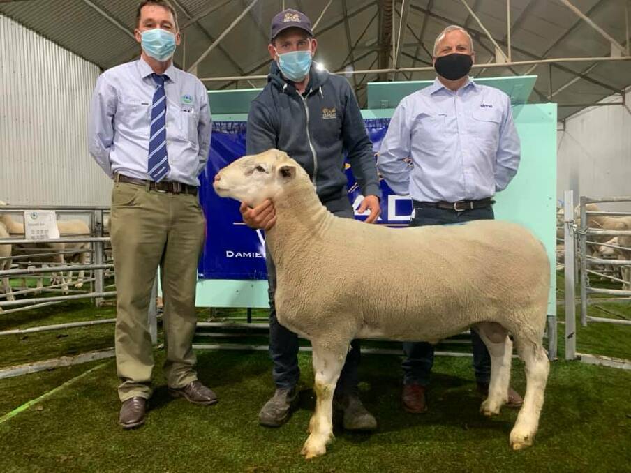 GREAT RESULT: Stuart Kyle, Westech Ag Kyle Livestock, Damien Hawker, Omad and Chris Barber Driscoll McIllree & Dickinson and the top priced ram.