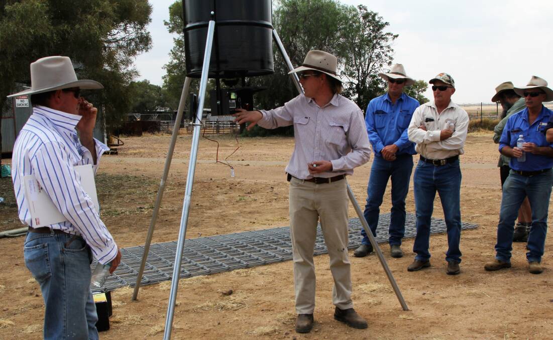 Feral facts: Landholders and local government rural lands officers were on hand to study the portability of the telemetrically triggered gate and automated feeding system. Pictures: Sally Cripps.
