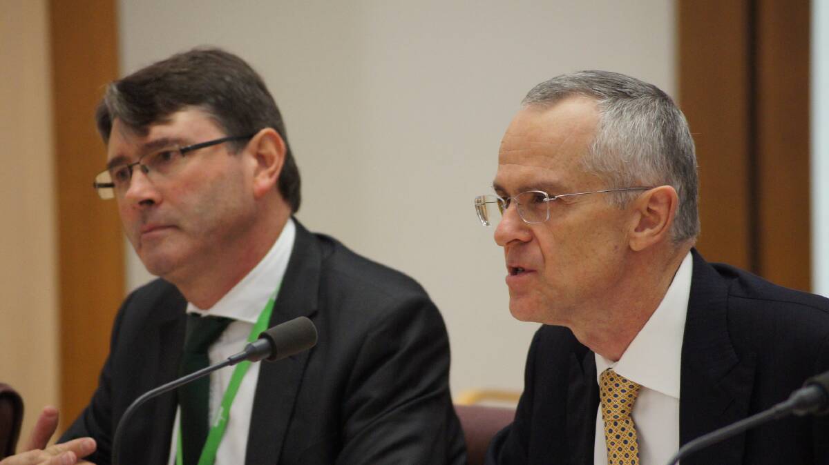 ACCC Enforcement and Compliance Executive General Manager Marcus Bezzi (left) and ACCC Chair Rod Sims face questions during this week's Senate hearing in Canberra.