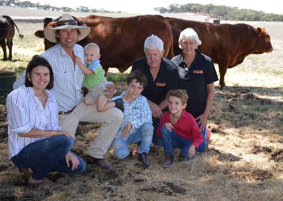 KEEN EYE: Maryvale's Tess and Matt Vogt, Kapunda, with children Mostyn, Alastair and Hamish, and buyers of the top price bull, and female, Kevin and Sue Nettleton, Unison Limousins, Boyanup, WA.