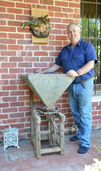 FACT SEARCH: Andrew May, pictured with a May Bros Seedsower built in 1887, has found his interest in family history turned into an eight-year project and two books on the state's history.