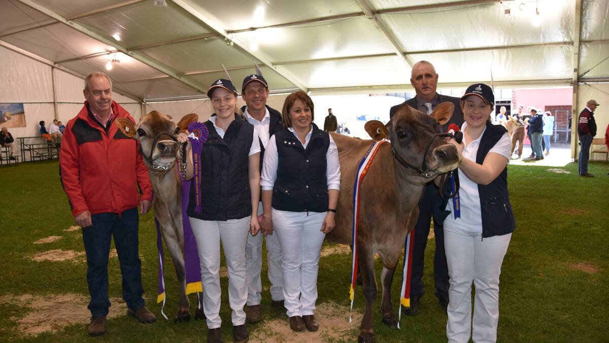 Elders' Rob French Courtney, Andrew, Angela and Taylah Koch, Ashtaney Jerseys, and judge Les Bennett, Macorna, Vic, with the reserve and senior champion female.