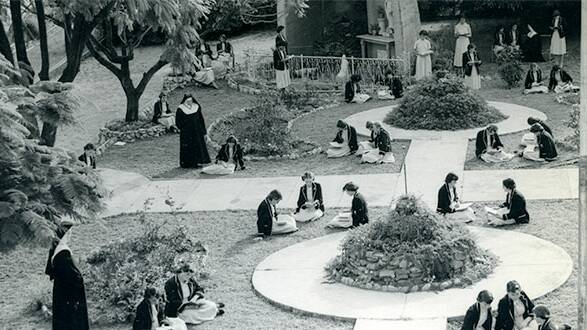 Peaceful study: Students studying in the garden at St Mary’s in 1956 under the supervision of the sisters. Photo: Good Samaritan Archives