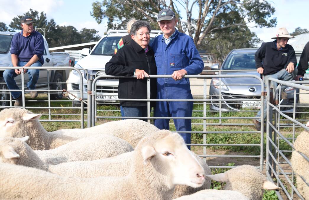TOP PICK: Leo and Marjorie Schubert, Bletchley, near Strathalbyn, with their crossbred lambs, which sold for $145, at the Mount Pleasant sale on Thursday last week.