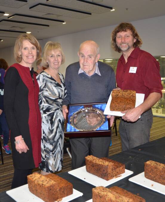 DEDICATION: The Margaret Hurst perpetual trophy was awarded by daughters Jane Dewing, Ann Hurst and husband Neil Hurst, to Vaughn Wilson, Wistow, who won first place for his fruit cake entry at this year's Royal Adelaide Show. 