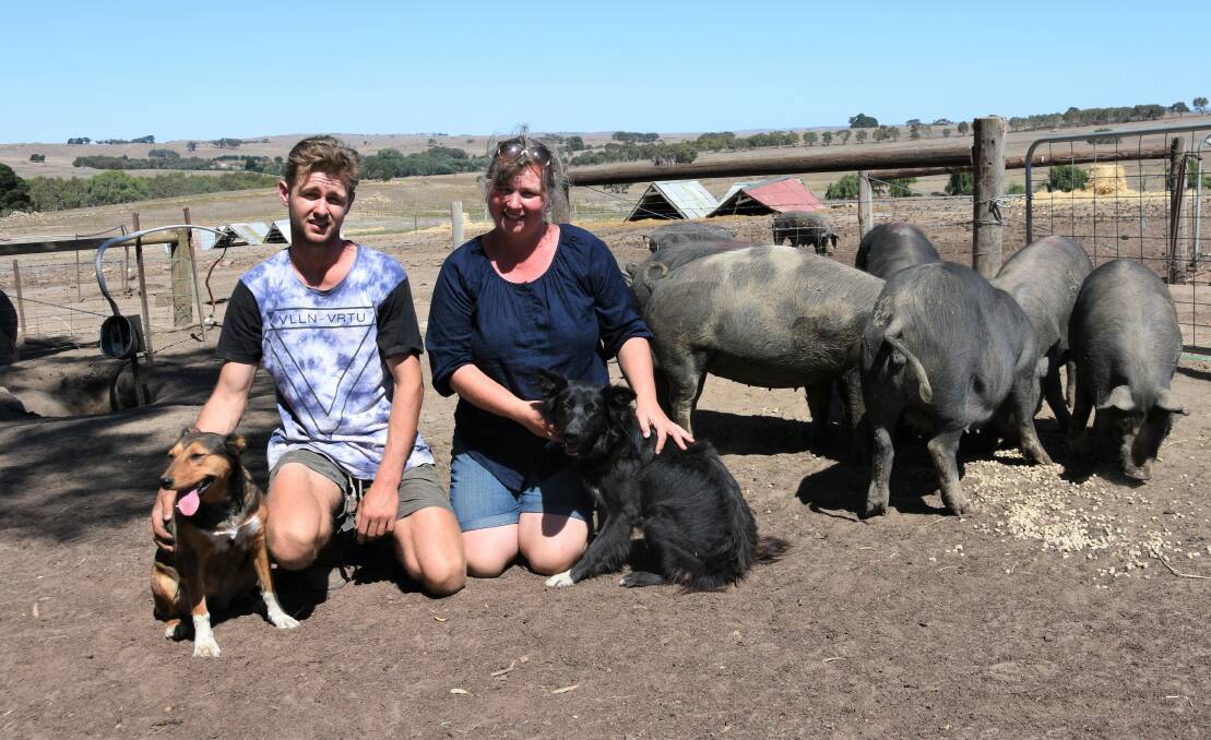 FREE-RANGE: Denni Mansfield (right) and her 19-year-old son Jesse, who was the main inspiration behind the family's 200-head Berkshire pig operation at Mount Pleasant. They are helped on-farm by dogs Pip and Ellie. 