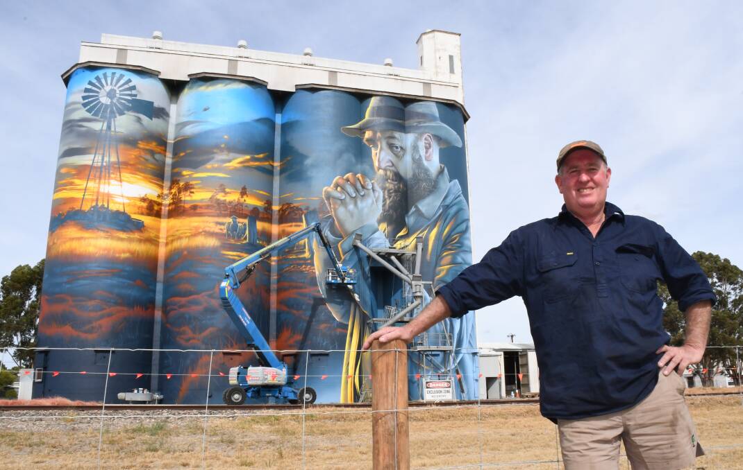 Lameroo farmer Lynton Barrett in front of the town's new silo artwork, that was completed on Wednesday by Sam 'Smug' Bates. Picture Quinton McCallum