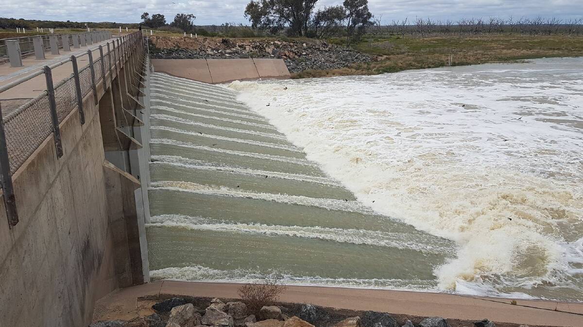  ABOUT TIME: Water flowing into Lake Menindee for the first time in three years, after the gates were opened on Thursday last week. Photos: DARRYN CLIFTON