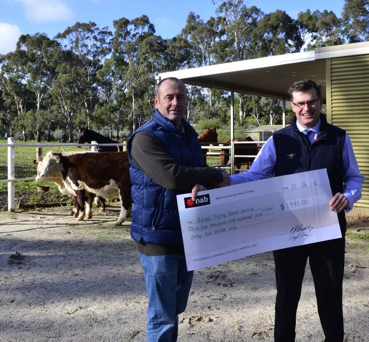 CHARITABLE WORK: Herefords SA president Lachy Day and RFDS central operations, marketing and public relations general manager Charlie Paterson. 