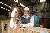 Coopers Brewery Clydesdale manager Mike Keogh is an expert when it comes to driving a four-in-hand. He is pictured here with Coopers Jacob, a 17-hand gelding he says has the potential to be a star in the showring.