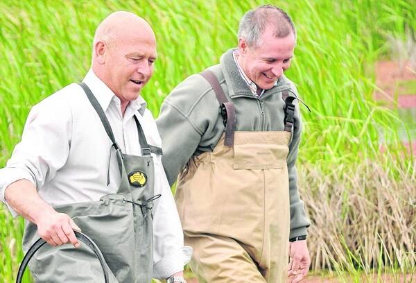 WELL-RESPECTED: Former Water Minister Paul Caica and Premier Jay Weatherill in late 2011, releasing new stocks of native fish into the wild.
