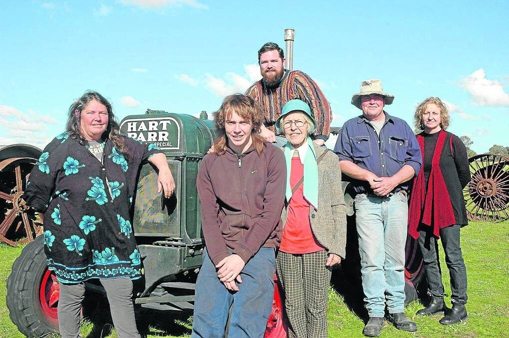 PROUD VENDORS: Pictured with one of the late John Calvert's favourite tractors, a 1929 Hart-Parr 18-36, are his daughter Mary Davis, grandson Brenton Calvert, widow Margaret Calvert, son Simon and daughter-in-law Karen Calvert. Seated at the back is John's grandson Daniel Davis.
