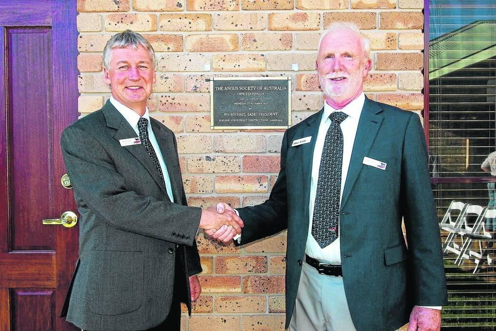 BUILDING STRENGTH: At the 2013 opening of Angus Australia’s Armidale, NSW, office extensions are chief executive Peter Parnell and president Mike Gadd.