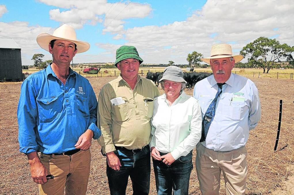 WINNING BID: Hazeldean co-principal Guy Cunningham and Pinkerton Palm Hamlyn & Steen director Robin Steen flank the buyers of the $6500 top-price bull Max and Briony Schleuniger, Bray.