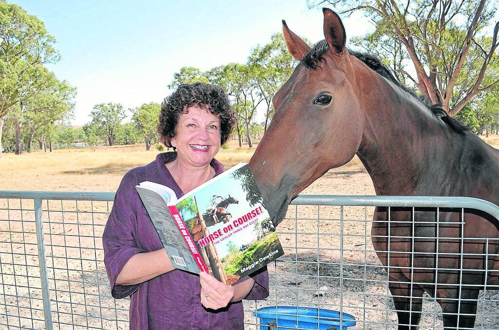 HORSE ON COURSE: Maggie Dawkins’ daughter’s eventer Hillbro Aramec takes a peek at her book on the history of the Gawler Three Day Event, titled Horse on Course! The Gawler Three Day Event.