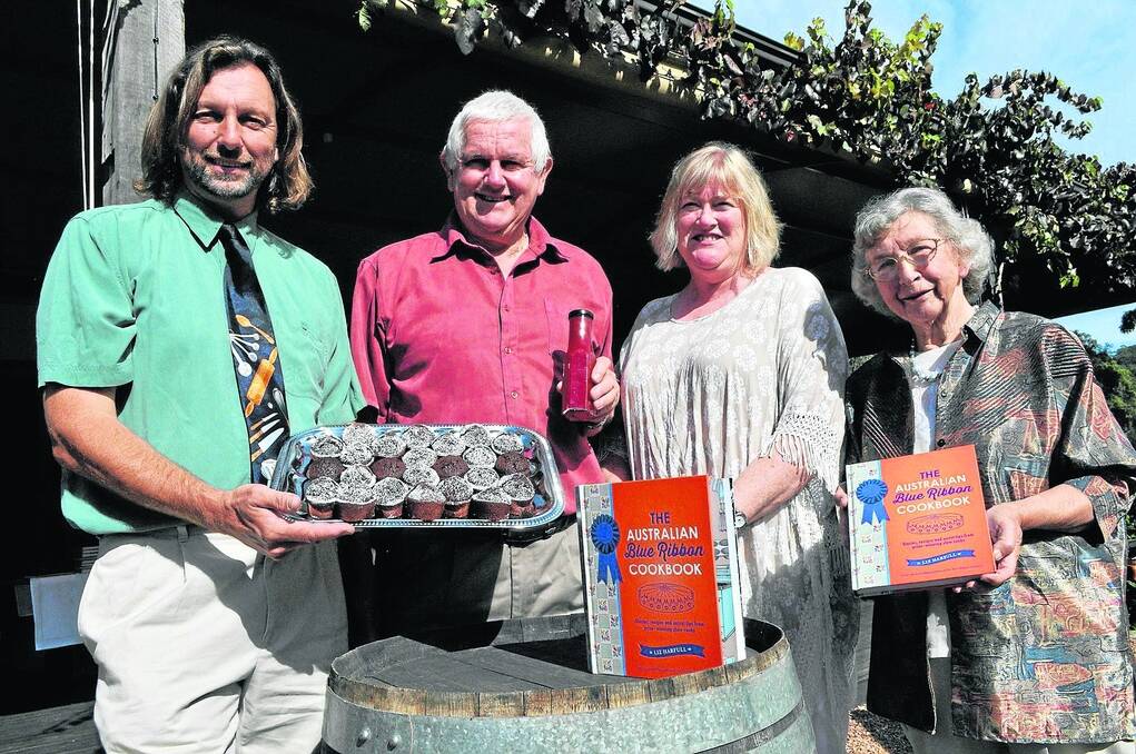 SHOW AND TELL: Author Liz Harfull (second from right) with three of five South Australian show cooks who feature in The Australian Blue Ribbon Cookbook – Vaughan Wilson, Wistow, with his Jaffa Friands; Rod Chapman, Tanunda, with Rod’s Bloody Hot Tomato Sauce, and Joyce Fendler, Tungkillo, who shared a recipe for mixed mustard pickle.