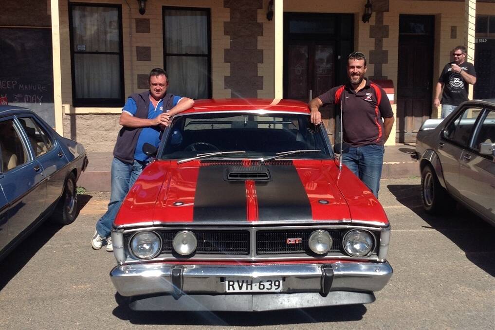 MEET THE BEAST: RMGH Pinnaroo’s Darryl McNeilly and Gavin Branson, Gawler Farm Machinery, with the powerful 1970 Ford Falcon XY GT replica they will drive in the Aussie Muscle Car Run in October.