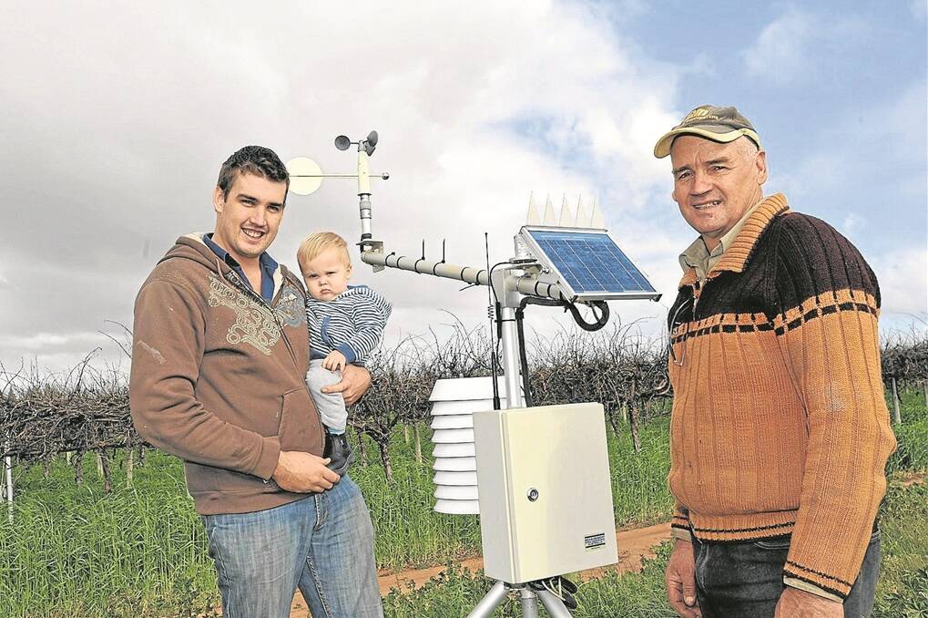 WEATHER WATCH: Waikerie’s Paul Wurst with his son William and father Tony at a station installed on their property boundary.