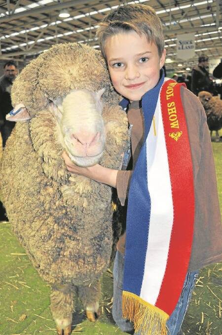 DOUBLE DELIGHT: Will Wadlow celebrated his 10th birthday with his parents’ winning grand champion strong wool Merino ram PF90.