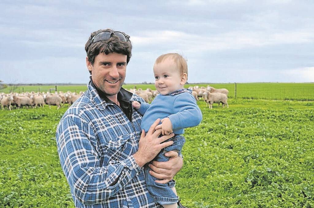 WEIGHS-UP: David Agnew, pictured with 12-month-old son Lincoln, says it is all about the carcase for the family – not wool.