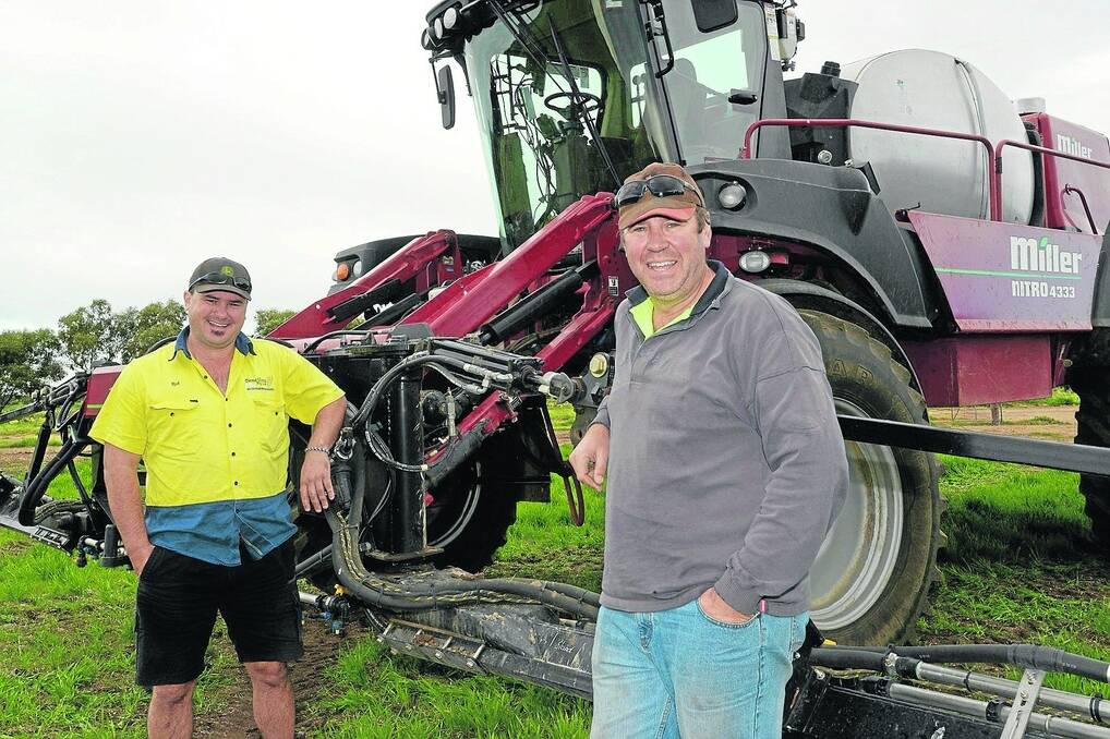 LOOKING GOOD: Dema Vista farm manager Dean Bruce, Maitland, with the company’s machinery operator Robert Price. Mr Bruce says even an average rainfall from here on would be "pretty well perfect". 
