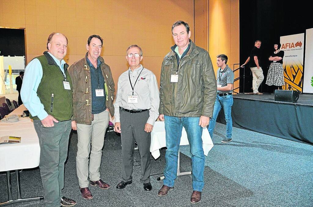 INNOVATIVE APPLIANCE: US farmer and innovator David Staheli (pictured second from right with Andrew Walter, Violet Town, Vic; Nine Mile lucerne producers and processors, Ken Schmidt , Crossroads, Qld, and Nine Mile’s Cameron Angel)  created ‘steam’ technology to make the process easier and more flexible.