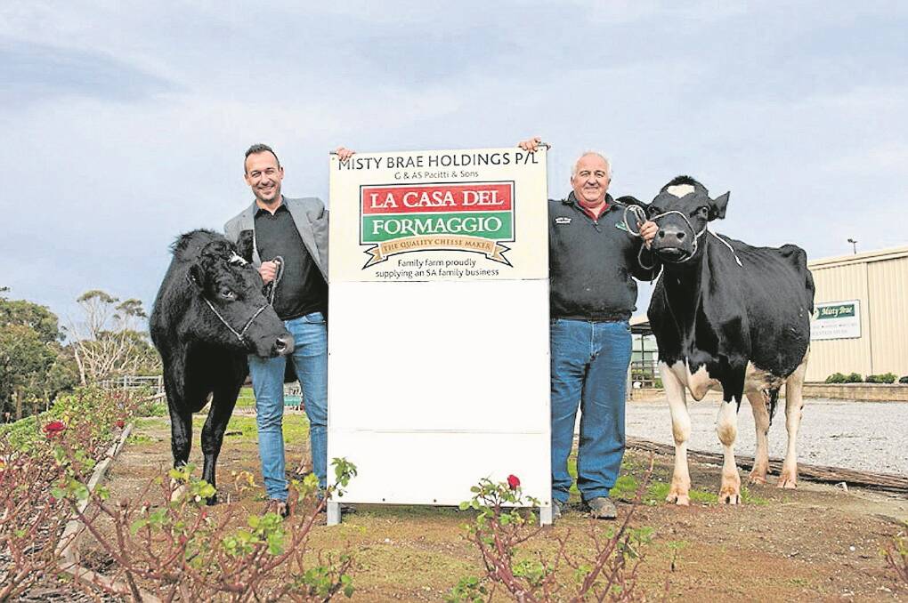 FLOW-ON BENEFIT: La Casa Del Formaggio managing director Claude Cicchiello with dairyfarmer Gino Pacitti, Misty Brae Holsteins, Myponga, who says the minimum price guarantee has boosted his confidence.