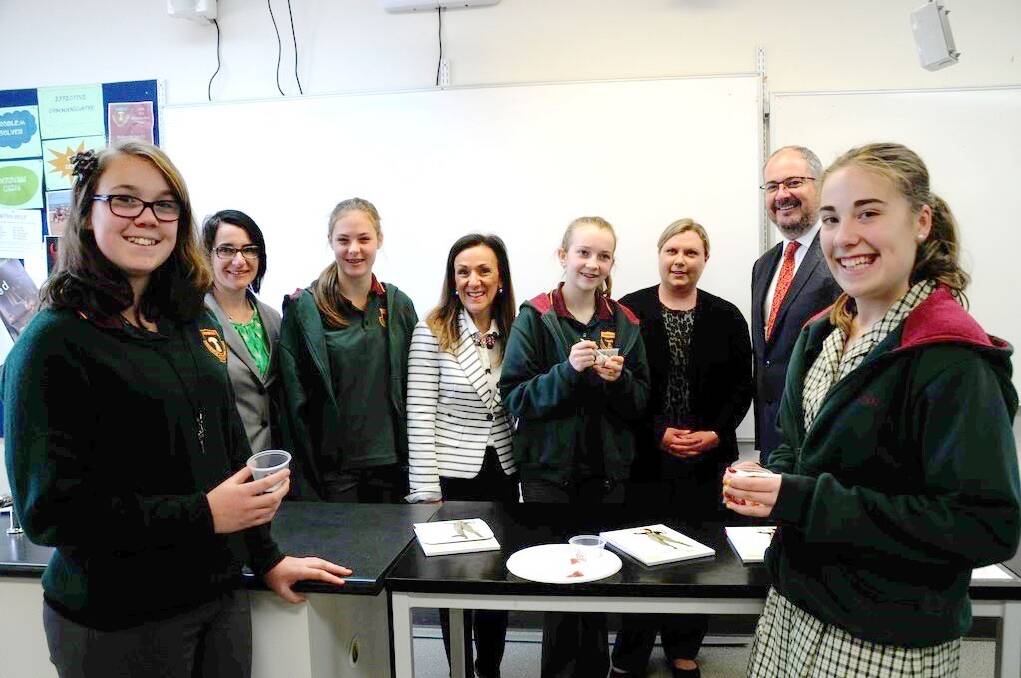 TOP TASTE: Urrbrae Agricultural High School student Kate Parsons, 2014 RIRDC rural woman of the year Penny Schulz, Ruby Kromer, cheesemaker Kris Lloyd, Rebecca McFarlane, sensory technologist Anna Crump, Agriculture Minister Leon Bignell and Kahlia Nissen taste test some produce at the launch of the Women Influencing Agribusiness and Regions Strategy.